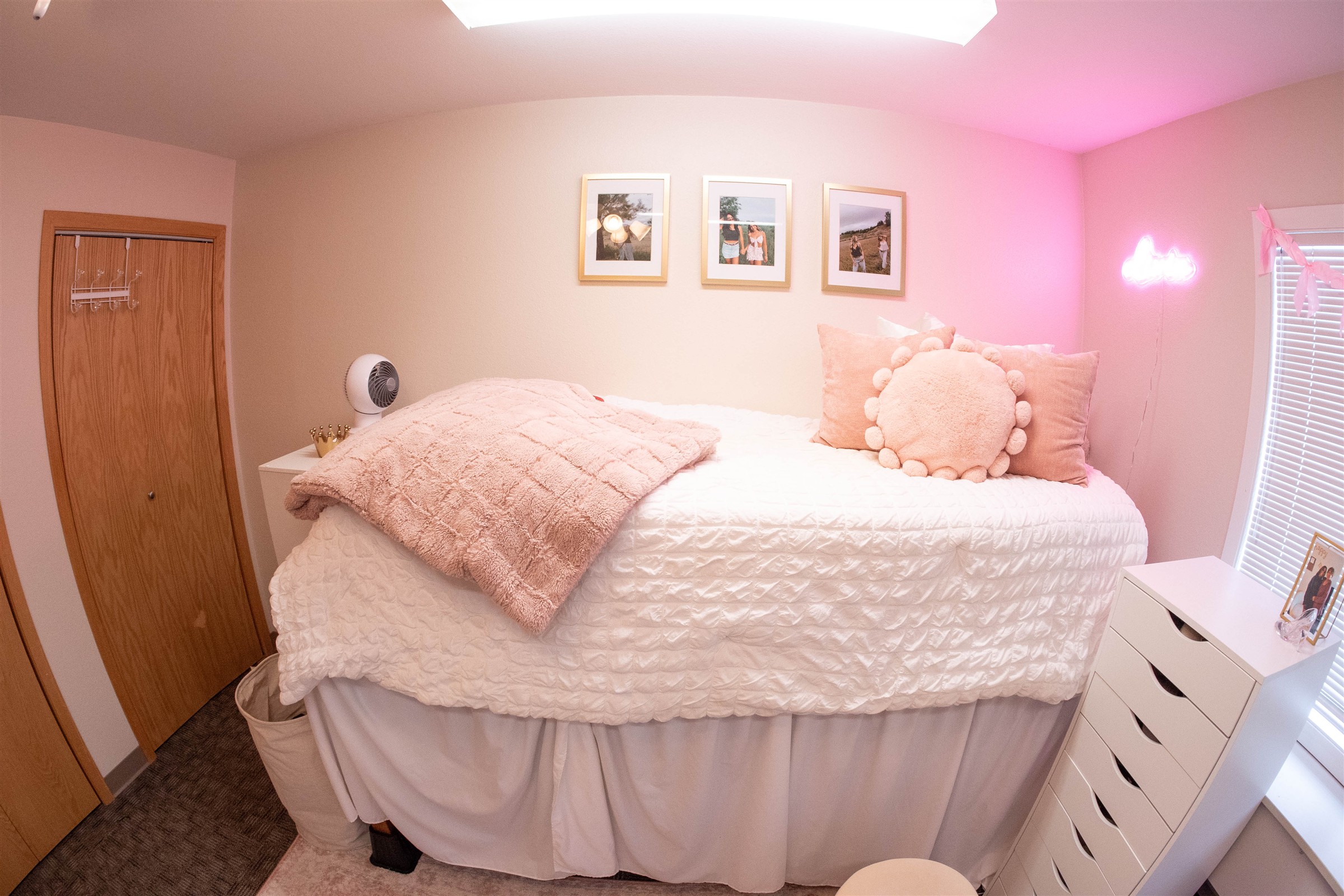 Interior of Mystic hall dorm room with pink decorations